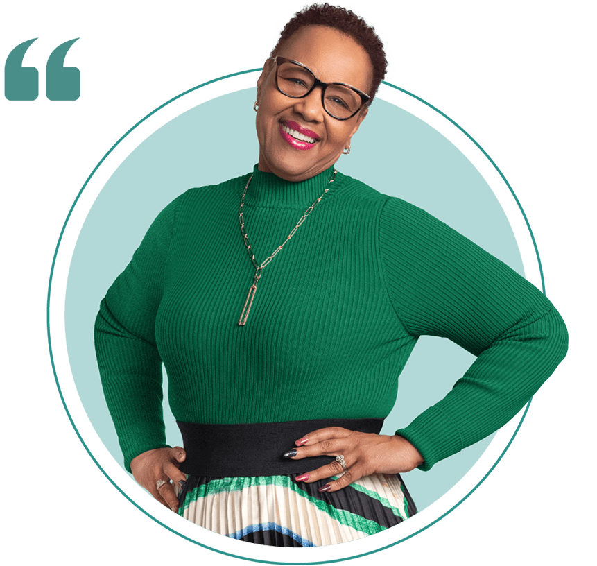 Renee wearing a green long sleeve shirt and glasses