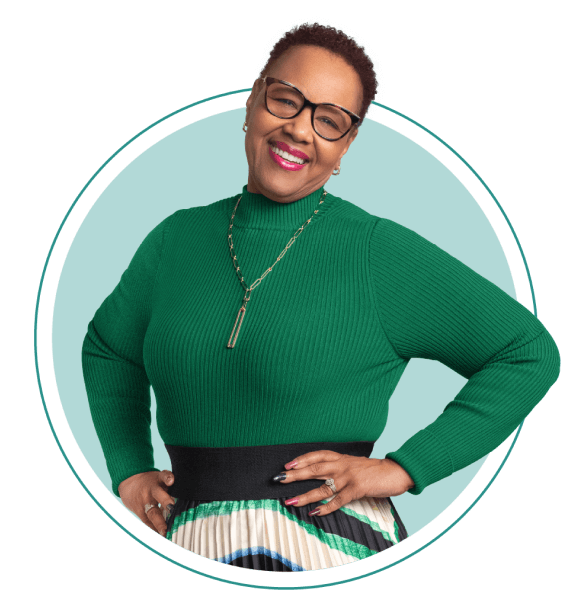 Renee wearing a green long sleeve shirt and glasses