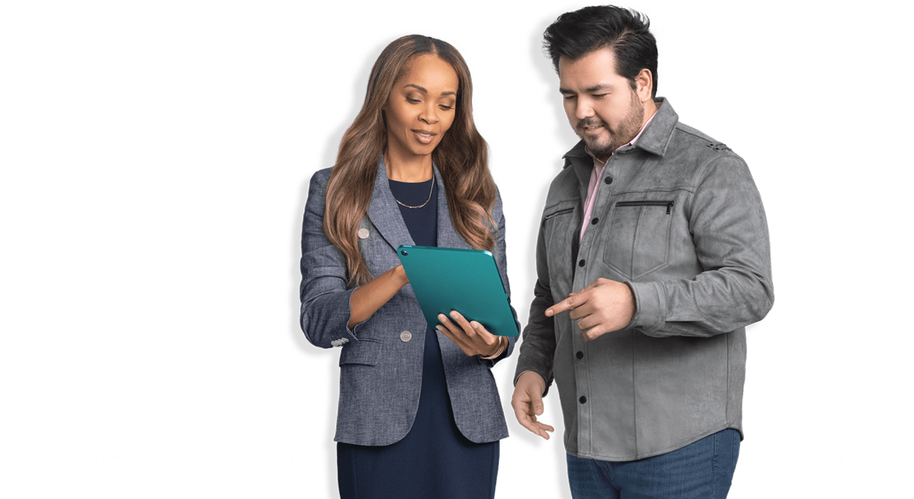 Man in gray jacket and HCP looking at a tablet